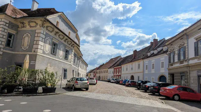 An old town street in Bad Radkersburg with historic cobblestones.